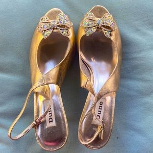 Gold open toed shoes